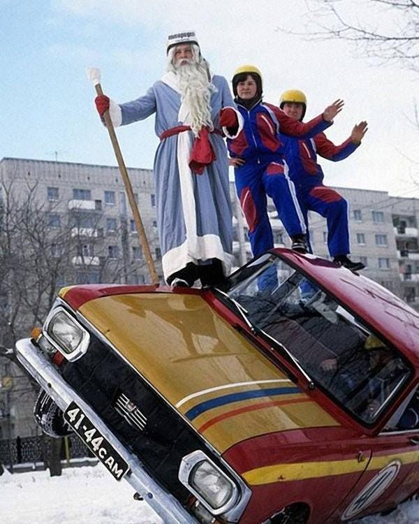 A daring stunt performed amidst lively winter celebrations in Moscow, USSR, 1978, showcasing Soviet era festive entertainment.