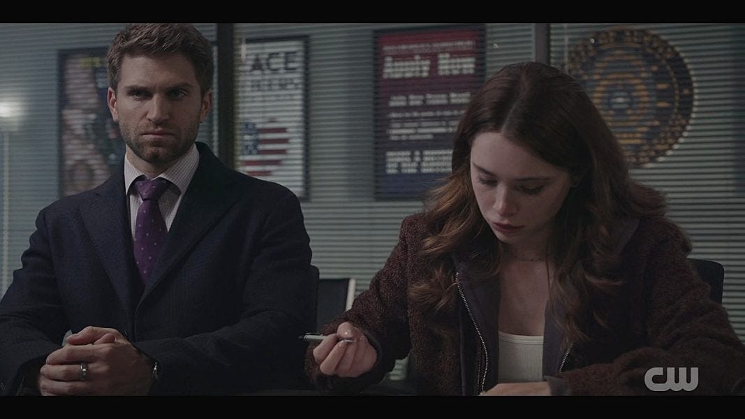 Walker LIam sitting with Stella to read over her statement about killing.