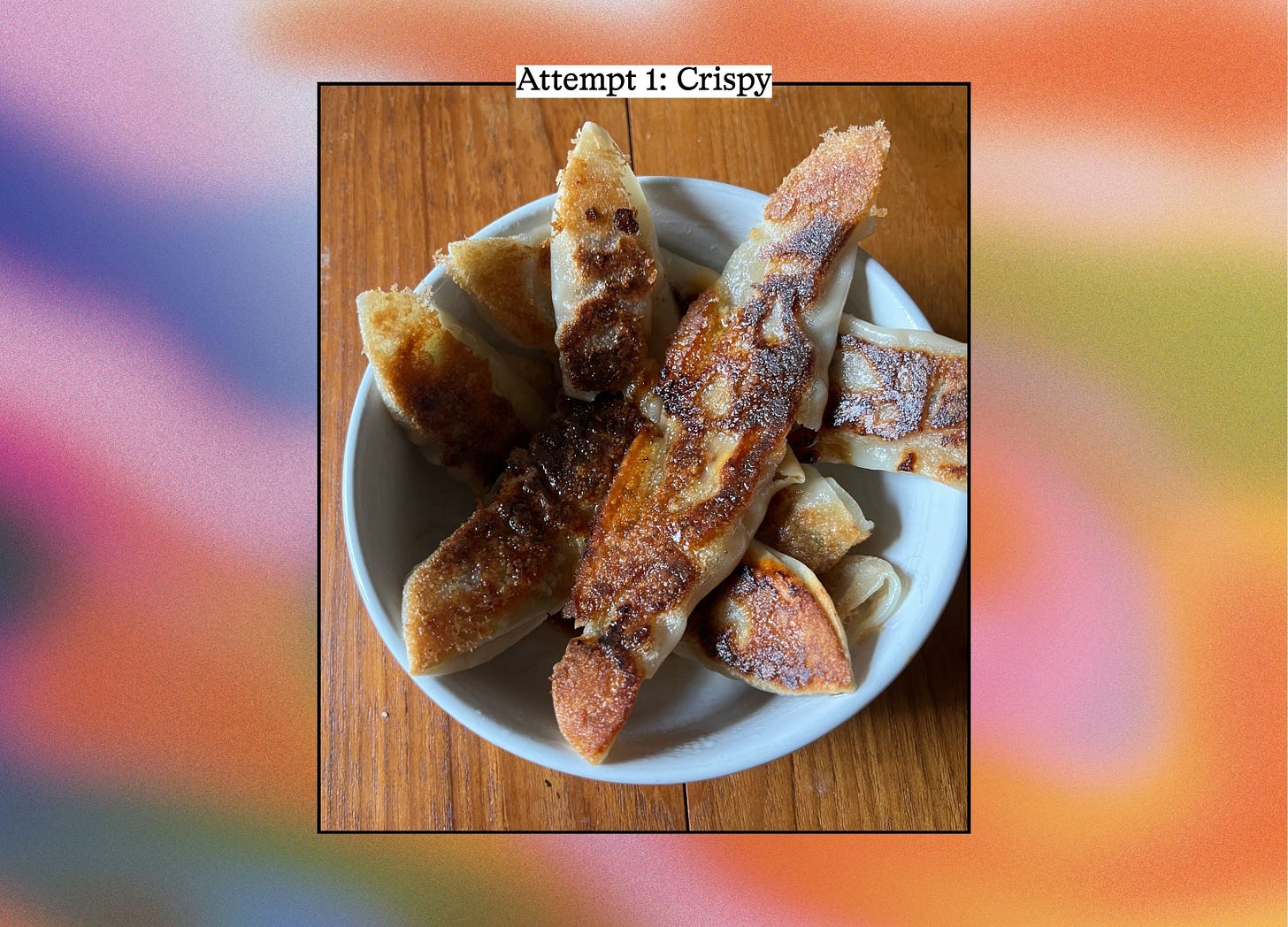 Overhead view of several pan-fried dumpling noodles with browned undersides in a white bowl. Text reads "Attempt 1: Crispy."