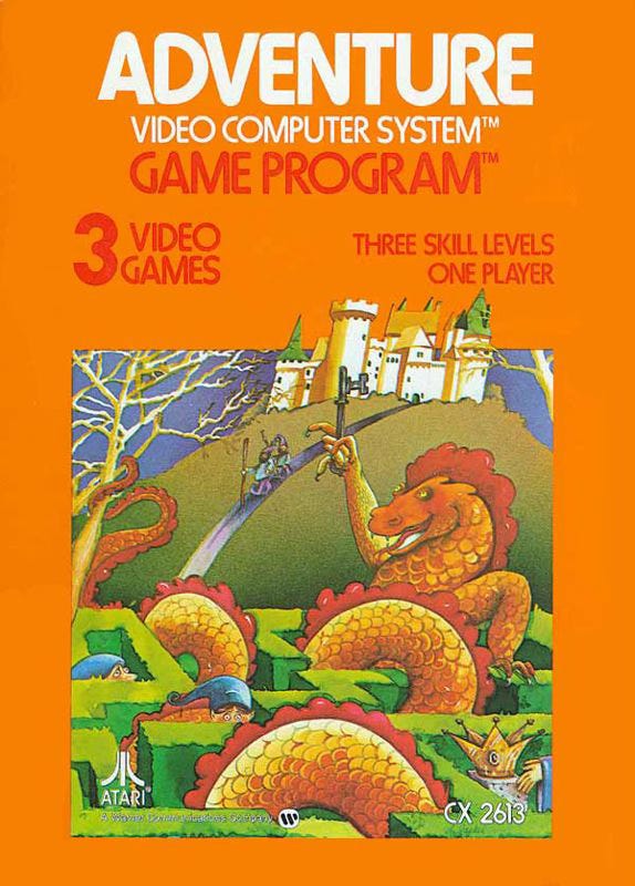 The box art for Atari Adventure is orange, and it features a highly detailed painting of a sword and sorcery scenario. At the top is an elaborate castle with towers and roofs and parapets. A road leads downward from the castle to an elaborate hedge maze, and two heroes in pointed caps with walking sticks walk down the road towards the maze. A giant orange dragon sits inside the maze holding a key aloft in its bony talons. The dragon’s snake-like body coils through the maze and wraps around a tree. Several other heroes in pointed caps are lost in the maze, and we can only see their heads. A gleaming bejeweled crown or chalice is visible in the foreground. The box art for Atari Adventure is orange, and it features a highly detailed painting of a sword and sorcery scenario. At the top is an elaborate castle with towers and roofs and parapets. A road leads downward from the castle to an elaborate hedge maze, and two heroes in pointed caps with walking sticks walk down the road towards the maze. A giant orange dragon sits inside the maze holding a key aloft in its bony talons. The dragon’s snake-like body coils through the maze and wraps around a tree. Several other heroes in pointed caps are lost in the maze, and we can only see their heads. A gleaming bejeweled crown or chalice is visible in the foreground.