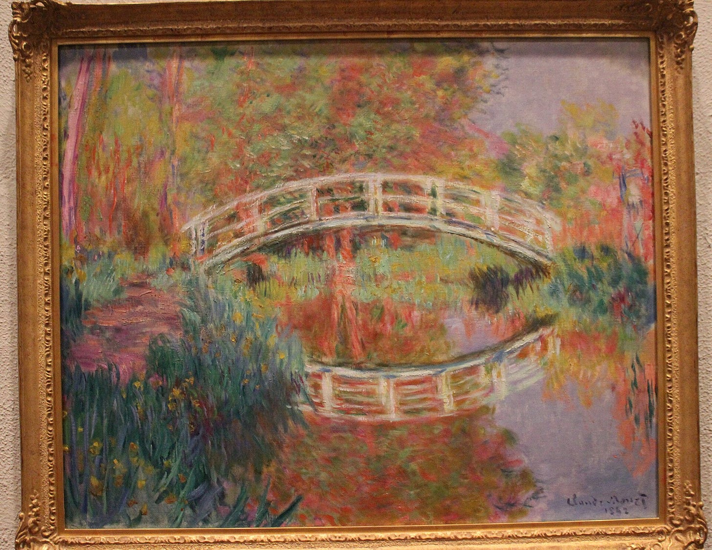 Claude Monet's painting of the green Japanese style footbridge over his water lily pond at Giverny Claude Monet's painting of the green Japanese style footbridge over his water lily pond at Giverny