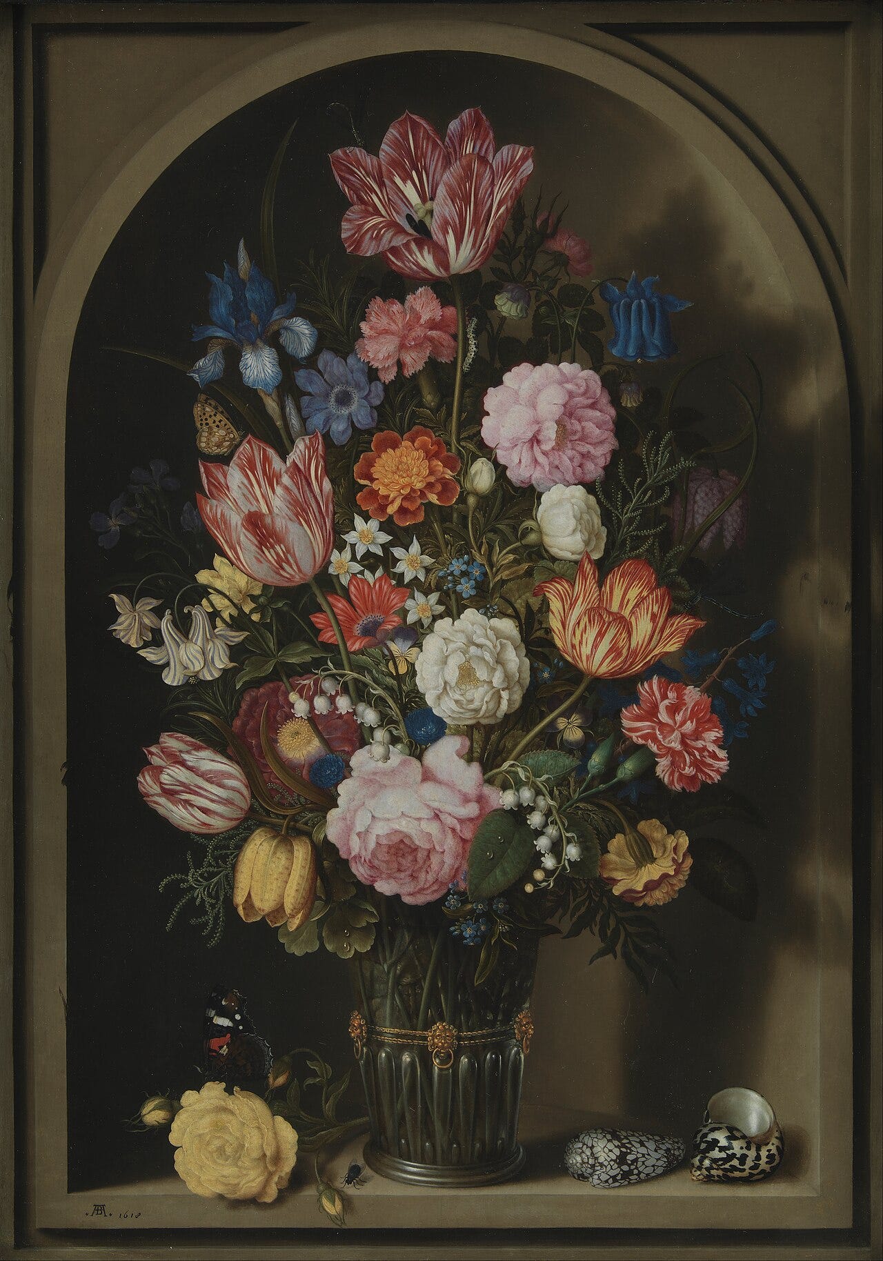 Bouquet of tulips and roses in a stone window Bouquet of tulips and roses in a stone window