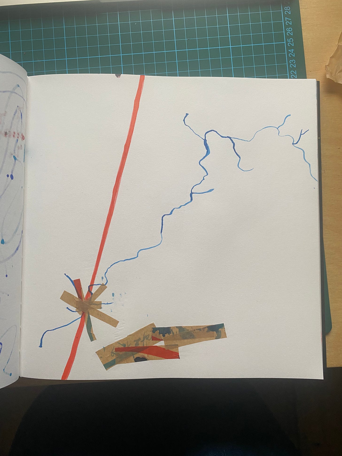 a photo of my sketchbook, which is an square shape featuring a rough illustration of the Frome from my sketchbook - the brown tape over the river represents where the Frome moves underground. 