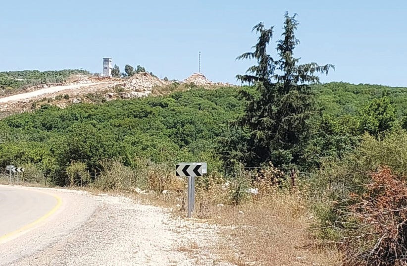A WHITE Hezbollah watchtower just a few meters from where the IDF is constructing a wall on the border with Lebanon, near Zar’it. (photo credit: HERB KEINON) A WHITE Hezbollah watchtower just a few meters from where the IDF is constructing a wall on the border with Lebanon, near Zar’it. (photo credit: HERB KEINON)