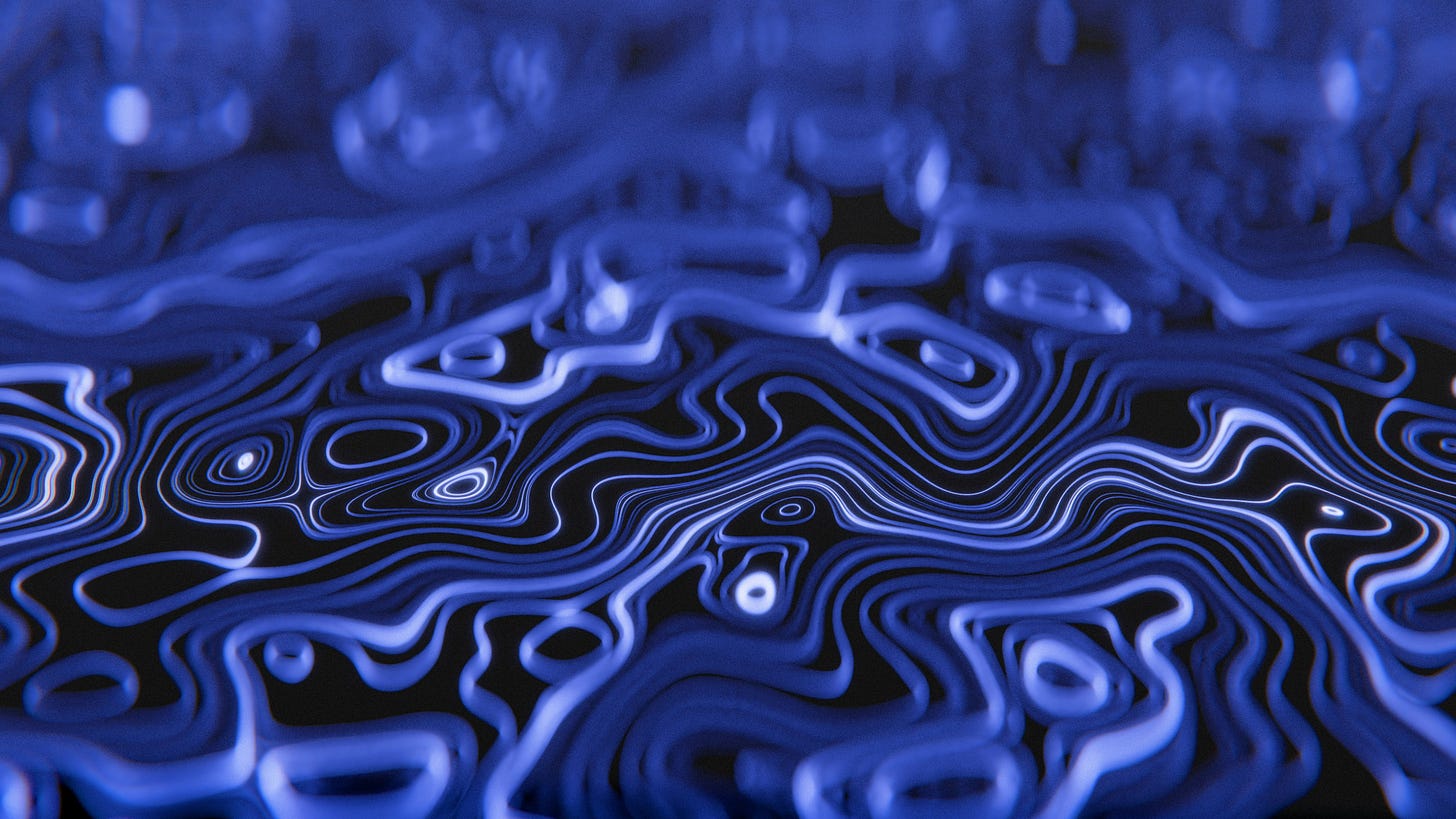 Abstract three-dimensional topographic contour lines in blue and white against a dark background, with depth of field creating sharp detail in the mid-ground and soft blur toward the edges.