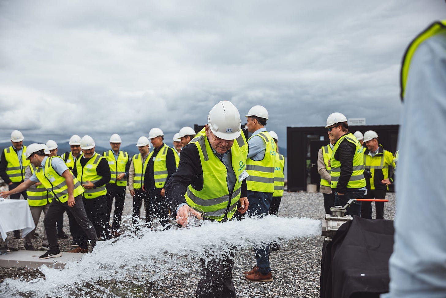 The team takes a drink of the first water produced by Flocean One