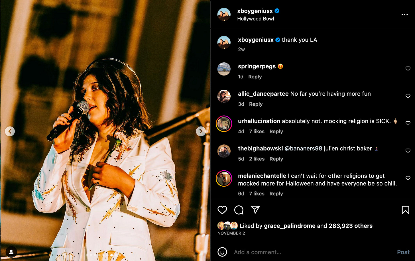 Screenshot of an Instagram post by boygenius. Lucy Dacus in her God the Father outfit sings into a microphone. Comments on the right side are a mixture of critical and supportive.