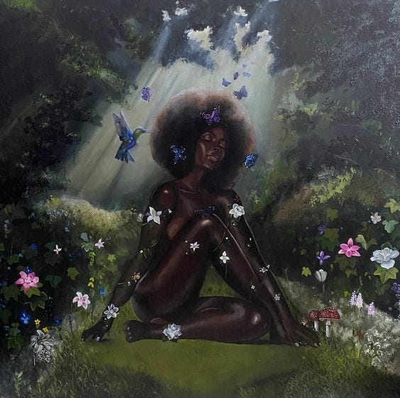 A beautiful dark skinned glowing woman is pictured naked with an afro, sitting in an opening of a forest surrounded by the floating birds, butterflies, fruit, and flowers growing around her.