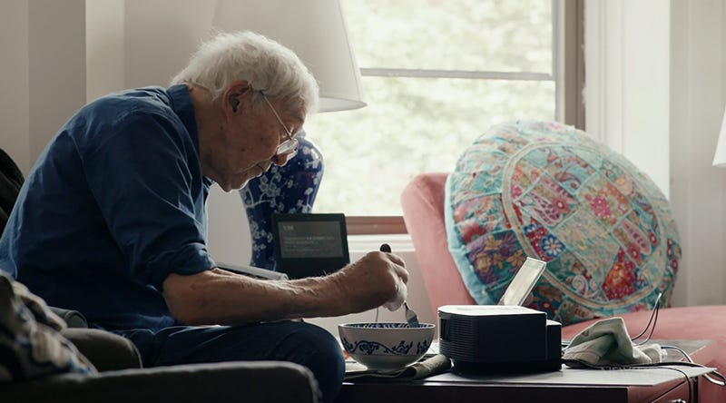 A screengran from the documentary “Drawing Life,” directed by Nathan Fitch. It shows cartoonist George Booth at home eating noodles.