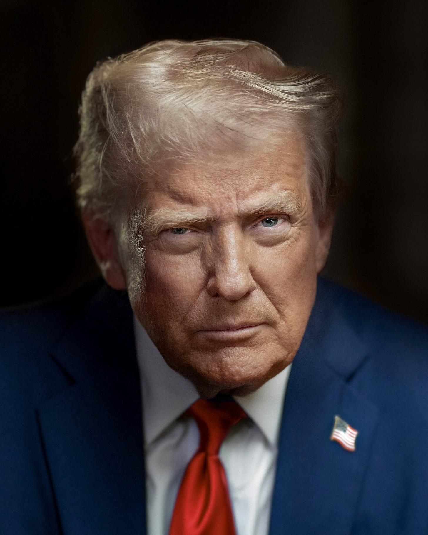 Head-and-shoulders shot of Trump with a serious facial expression, his right eye partly closed. He is wearing a dark blue suit, a pale blue dress shirt, a red necktie, and an American flag lapel pin. Parts of the image are slightly blurred. The background is black. Head-and-shoulders shot of Trump with a serious facial expression, his right eye partly closed. He is wearing a dark blue suit, a pale blue dress shirt, a red necktie, and an American flag lapel pin. Parts of the image are slightly blurred. The background is black.