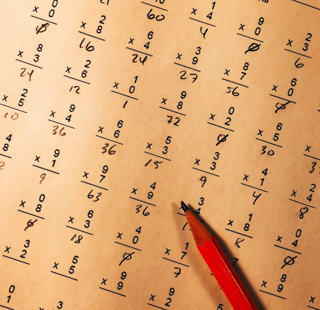 red pencil on top of mathematical quiz paper red pencil on top of mathematical quiz paper