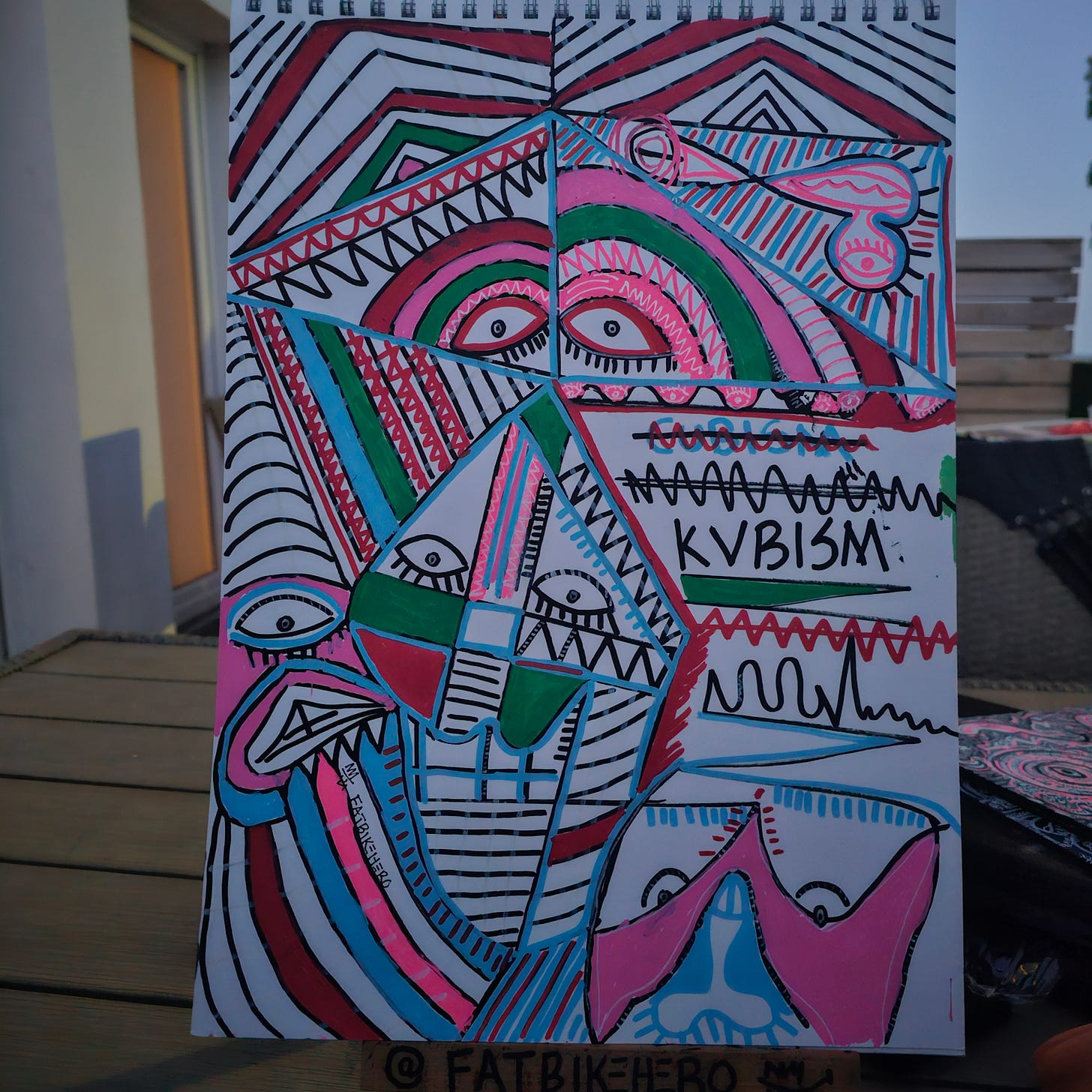 Fragmented abstract face with geometric patterns and “KVBISM” text