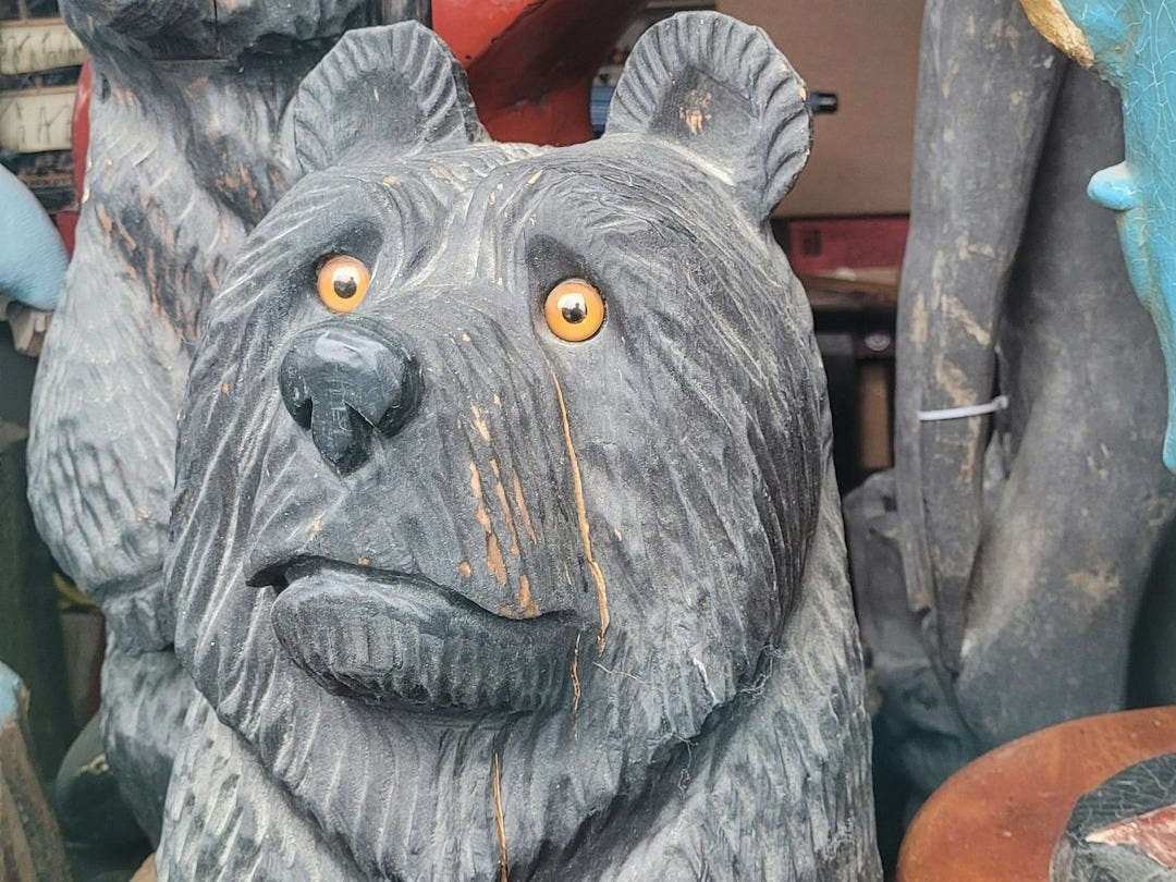 a close up of a statue of a bear