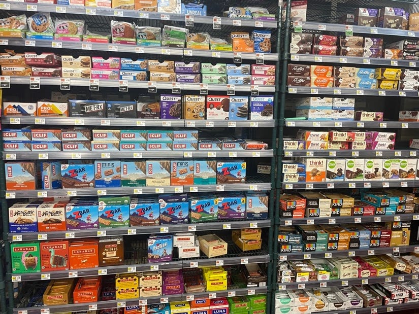 A shelf of food in a store

Description automatically generated