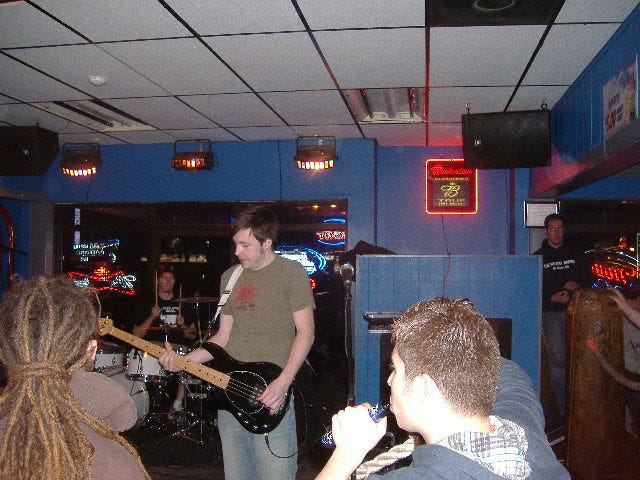Why is it that bassists are always looking down? Curt was just churning out the low end rhythm. Why is it that bassists are always looking down? Curt was just churning out the low end rhythm.