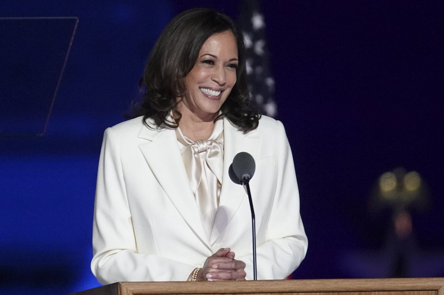Image may contain Kamala Harris Audience Human Crowd Person Speech Lecture Electrical Device and Microphone