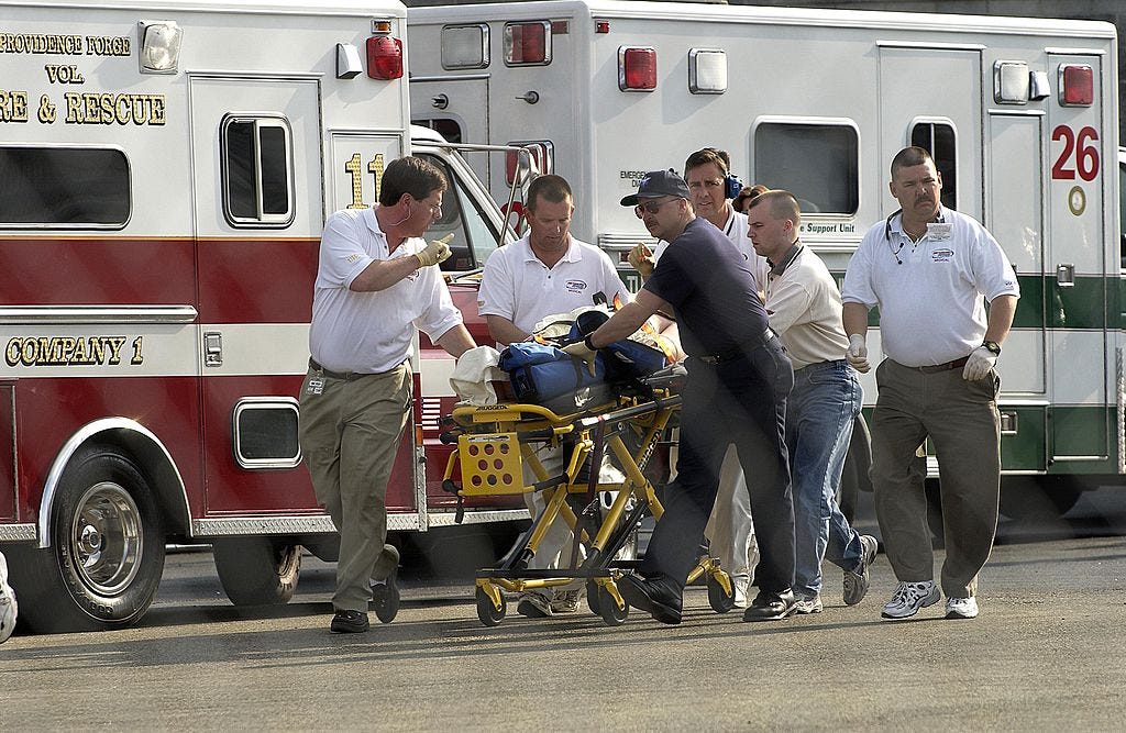 Rescue workers assist Jerry Nadeau following his 2003 accident. Rescue workers assist Jerry Nadeau following his 2003 accident.
