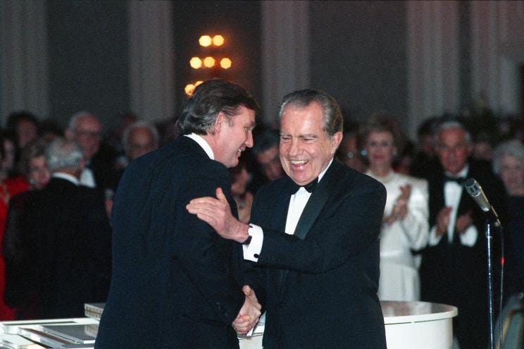Donald Trump shakes hands with former President Richard Nixon at a gala in Houston in 1989.