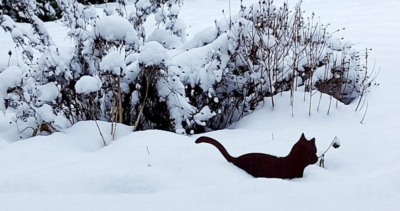 Cat figurine in the snow