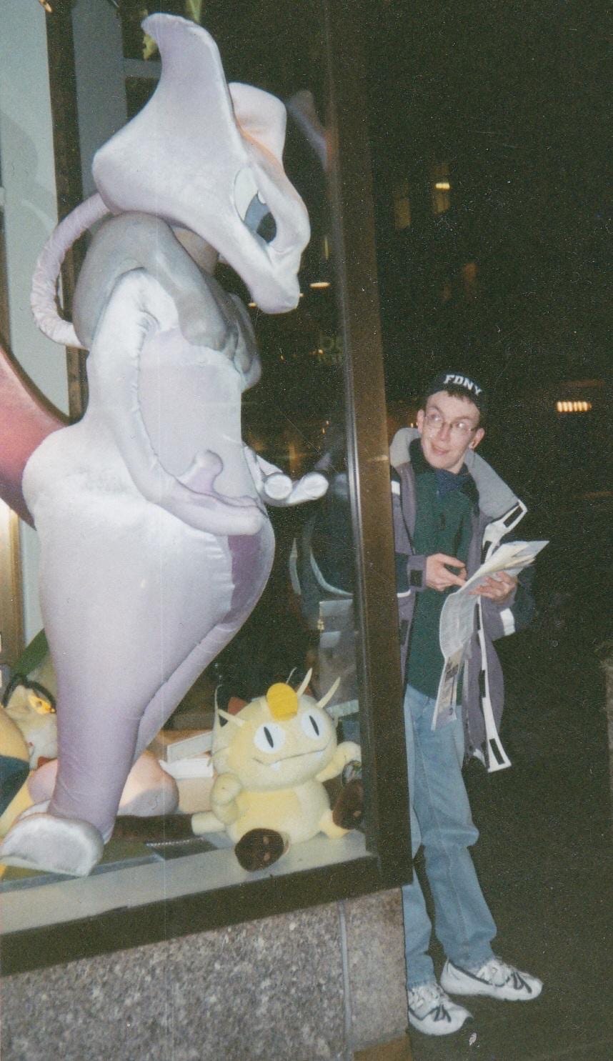 Mewtwo in the window of the Pokémon Center New York store.