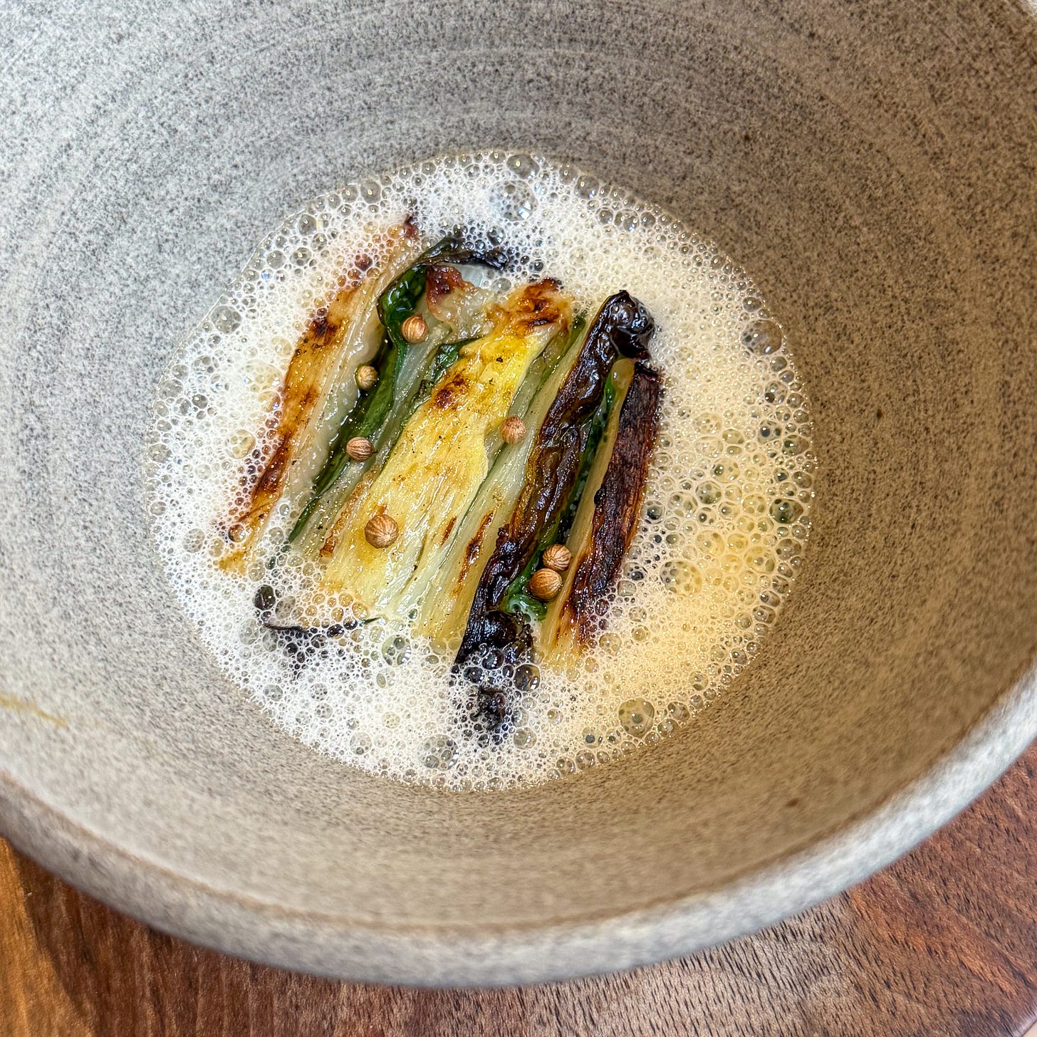Charred white asparagus in wild garlic foam with coriander at Eme, Paris 4th