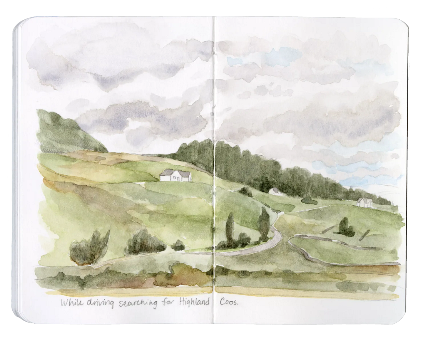 An open sketchbook with a watercolor sketch of a landscape.