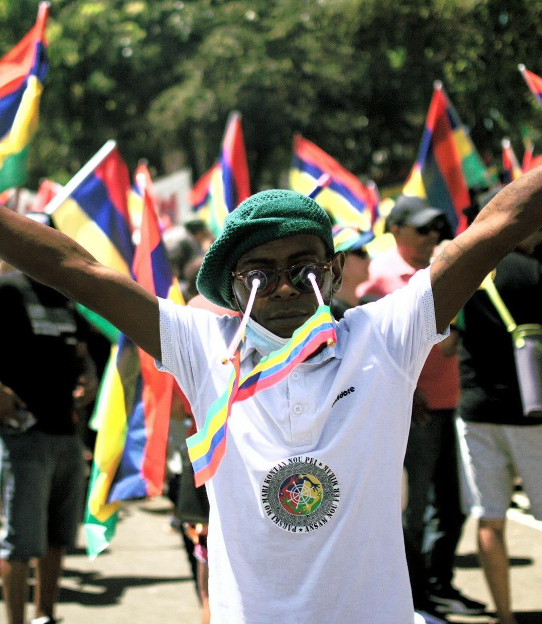 man in white crew neck t-shirt wearing green and yellow goggles