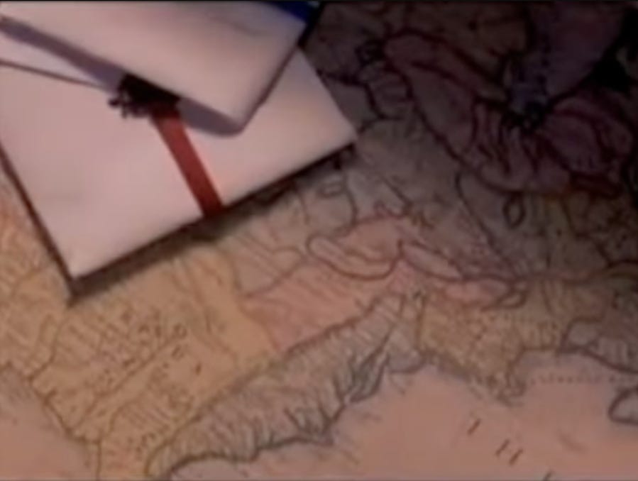 A map with a piece of paper and a pen on it
AI-generated content may be incorrect.