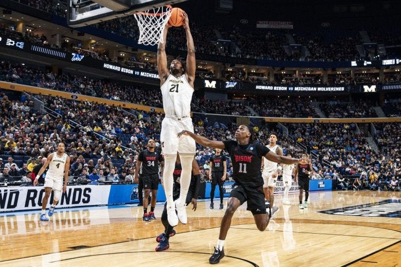 Morez Johnson Jr. dunks the basketball.