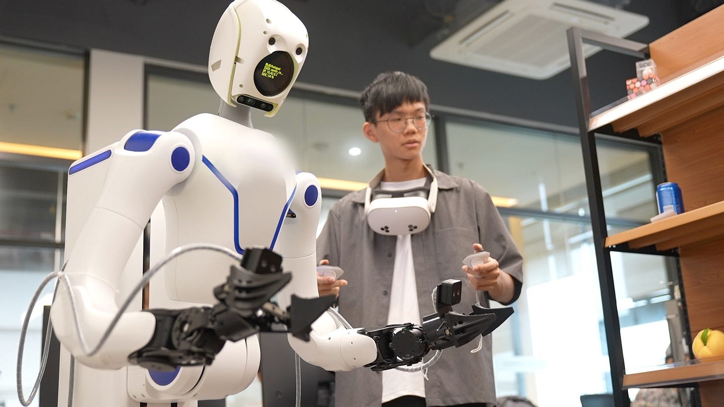 Lu Bingrui, a rising college senior from China's Taiwan region, operates a humanoid robot at a tech startup in Guangzhou, Guangdong Province, July 15, 2026. /CGTN