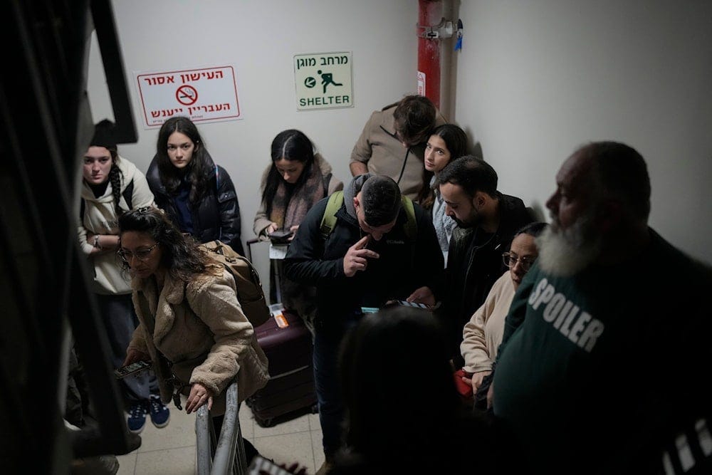 People gather in a shelter after airstrike sirens sounded off in Ben Gurion Airport, Occupied Palestine, early Friday, Jan. 3, 2024 (AP) People gather in a shelter after airstrike sirens sounded off in Ben Gurion Airport, Occupied Palestine, early Friday, Jan. 3, 2024 (AP)