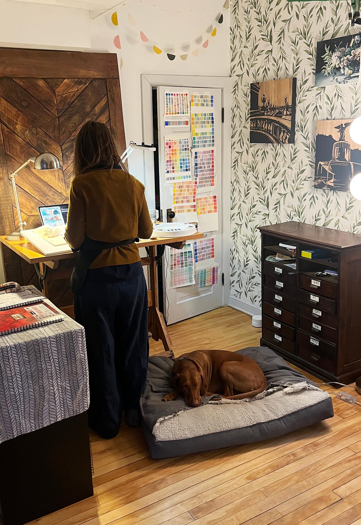 Lief the one-eyed Visla sleeps on his doggy bed as K. Woodman-Maynard creates in her studio. Lief the one-eyed Visla sleeps on his doggy bed as K. Woodman-Maynard creates in her studio.