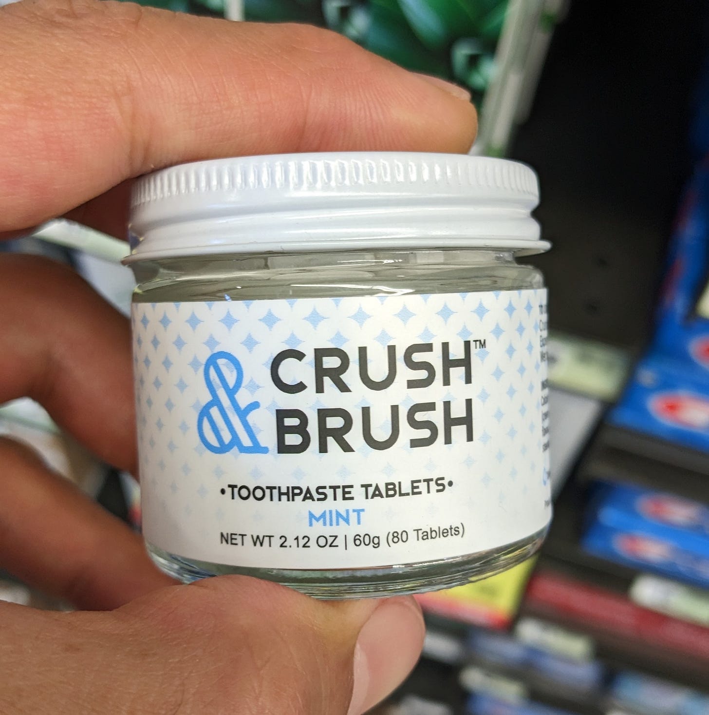 photo of a small glass bottle with dental tablets meant to be for brushing teeth