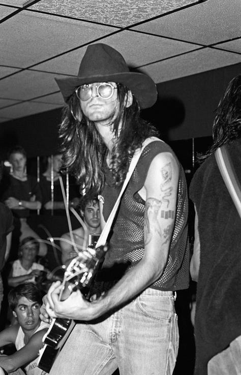 Gallery of 9 images of band Redd Kross, a rockband playing live in a small club called Cathay de Grande in Los Angeles.