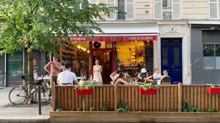 Photo of a wine bar street terrace in the 18th arrondissement. Photo of a wine bar street terrace in the 18th arrondissement.
