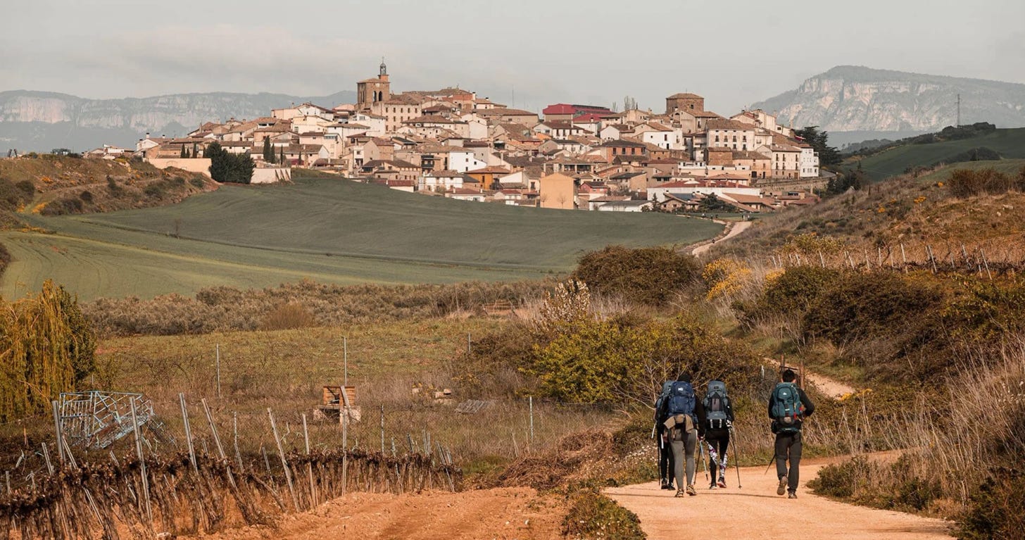 A pilgrim cycling along the Camino Francés through northern Spain. A pilgrim cycling along the Camino Francés through northern Spain.