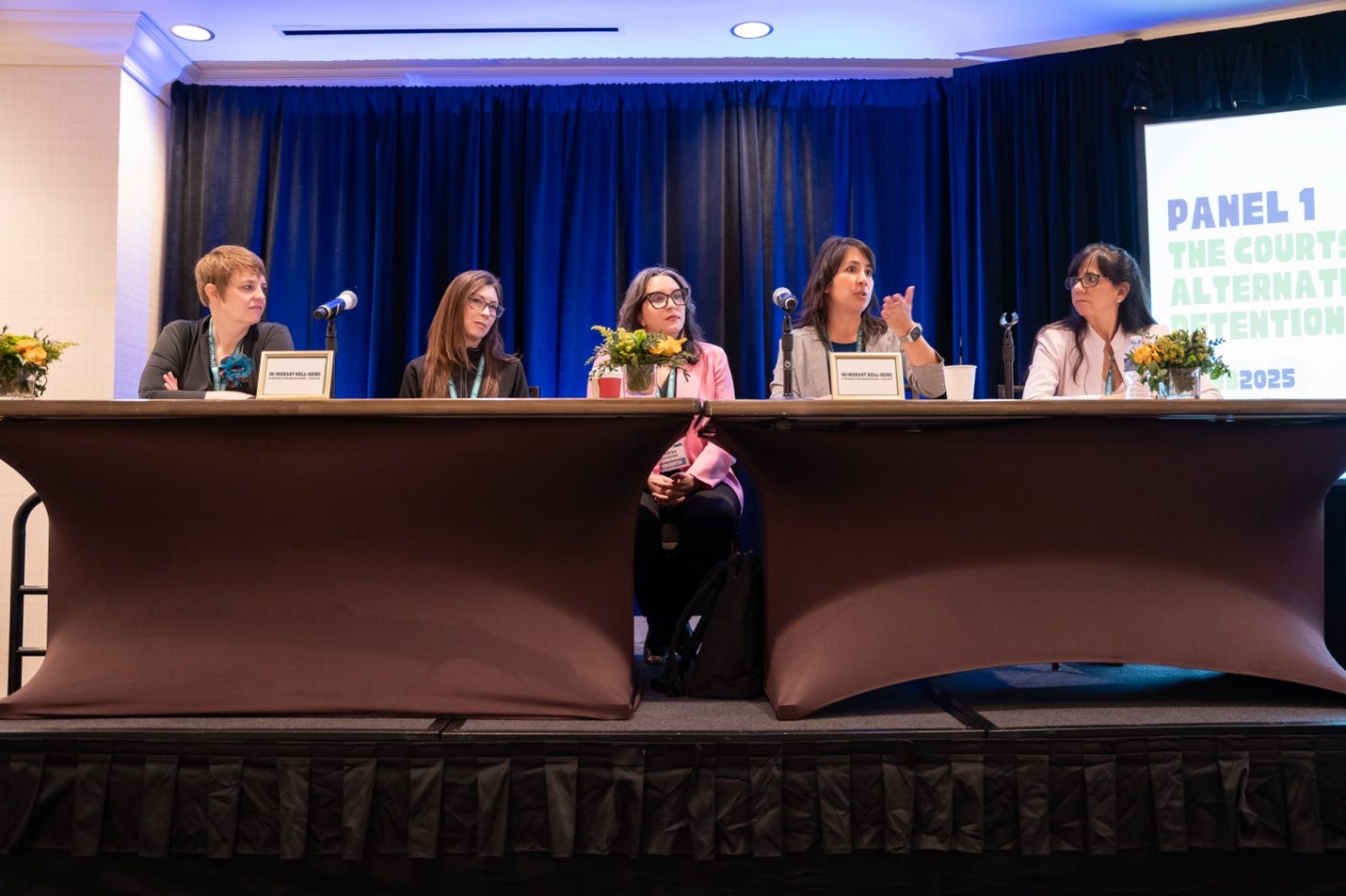 A group of women sitting at a table

AI-generated content may be incorrect.