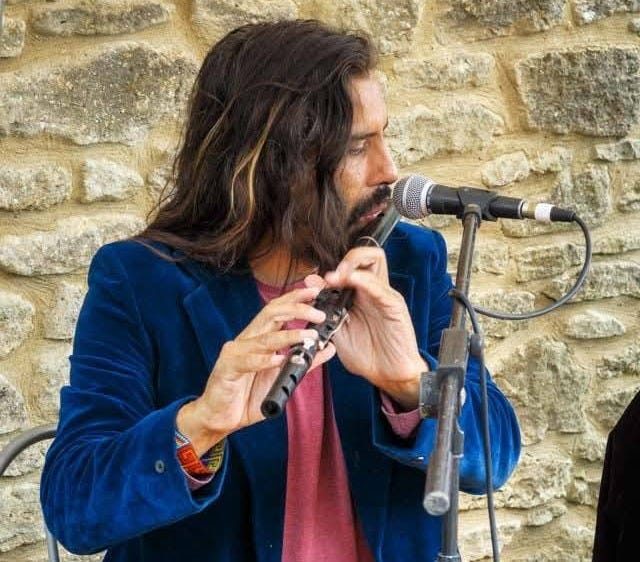 May be an image of flute and guitar