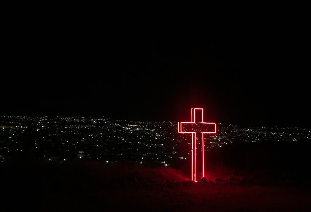 red neon light cross signage