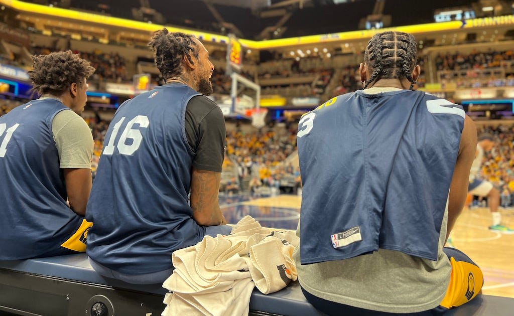 Terry Taylor, James Johnson and Aaron Nesmith watch the team scrimmage at Pacers FanJam 2022.