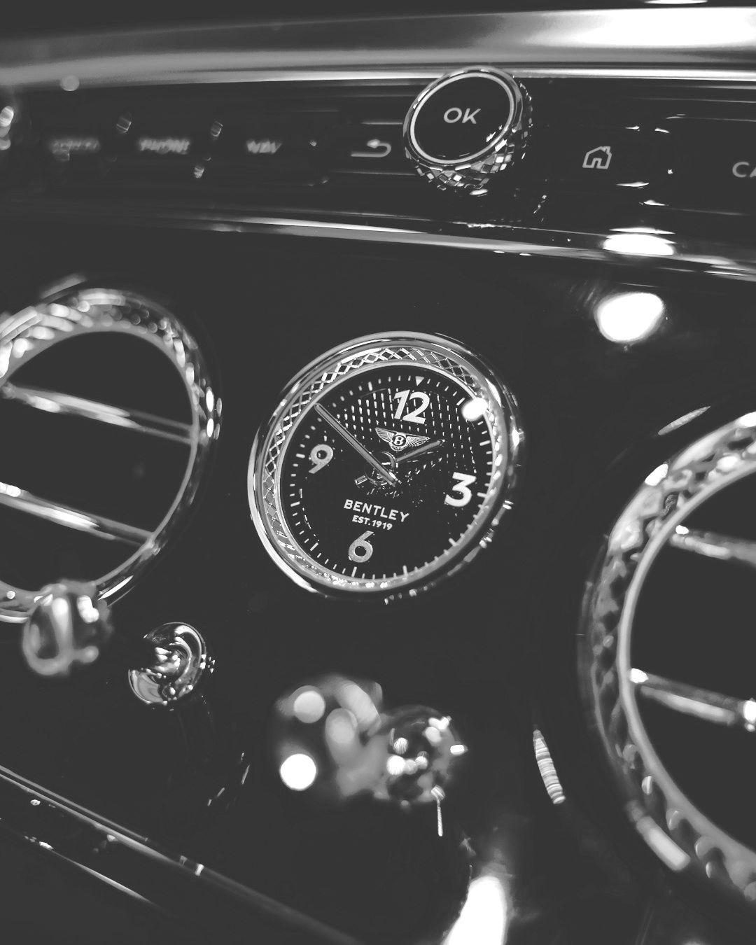 A close up of a car dashboard with a clock A close up of a car dashboard with a clock