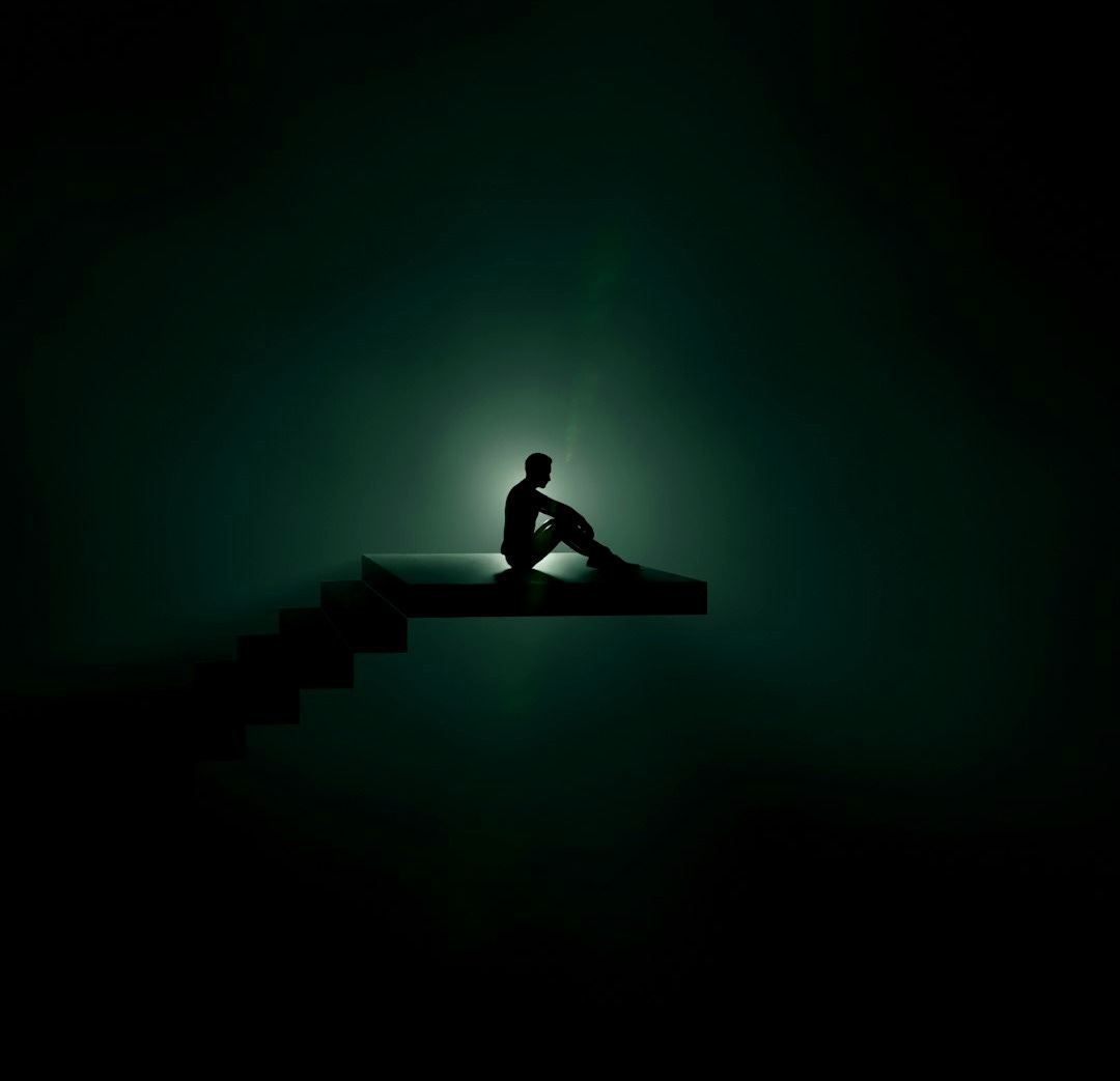 a person sitting on a bench a person sitting on a bench