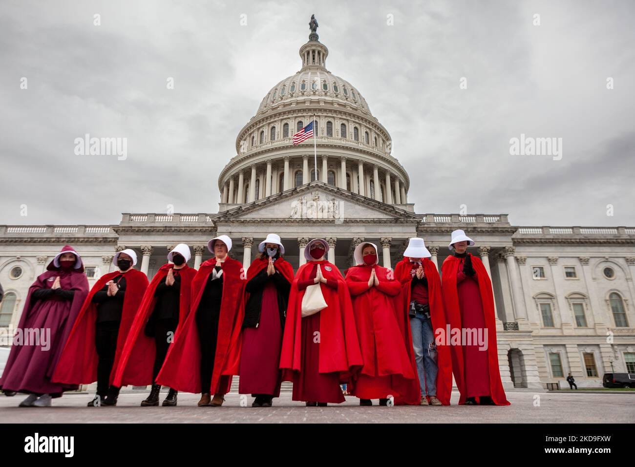 Demonstrators dressed as handmaids from The Handmaid's Tale, stand in ...