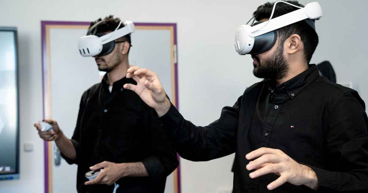 Men Experiencing Virtual Reality Indoors Men Experiencing Virtual Reality Indoors