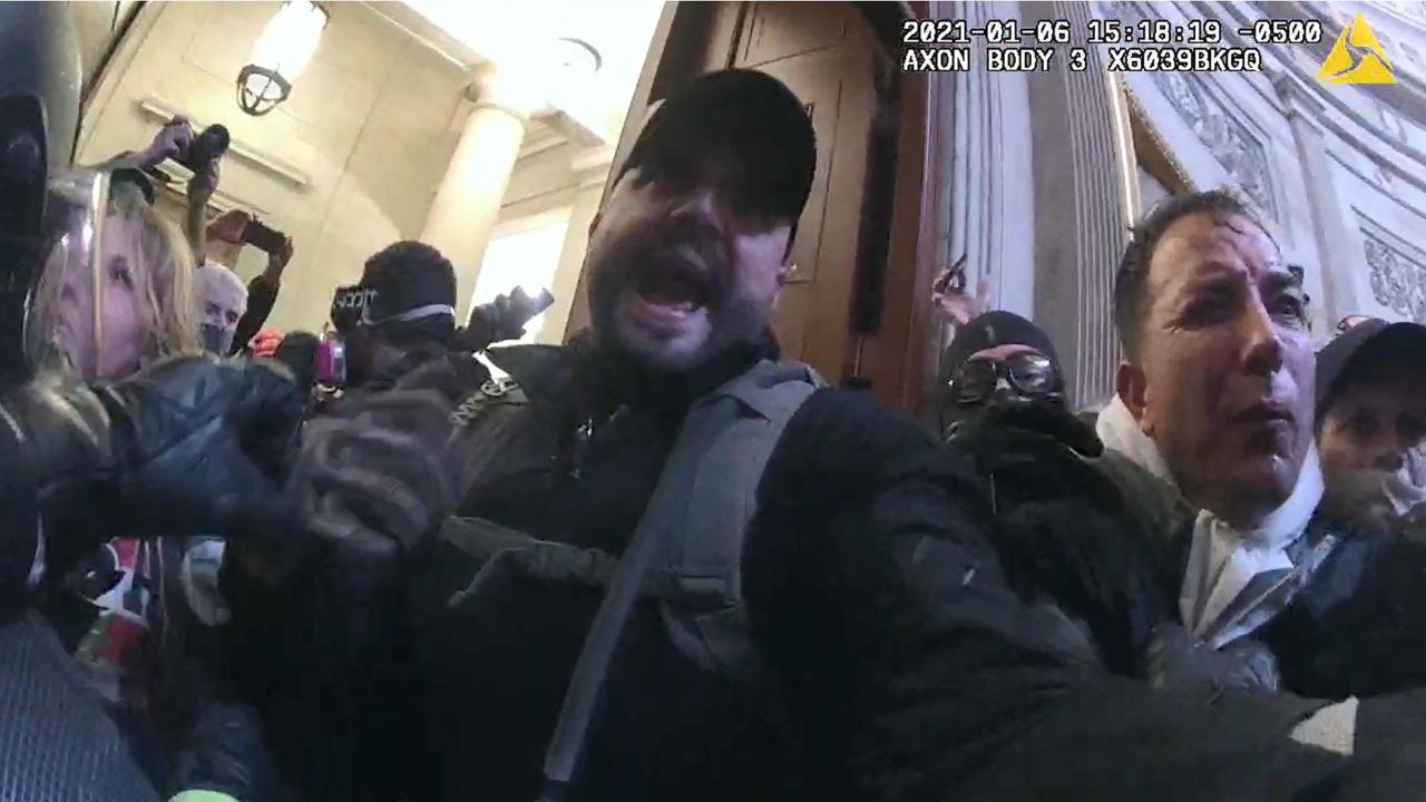 A judge said it was "mystifying" that alleged Oath Keeper Joshua James played "an active role" in the January 6 attack, considering the Purple Heart he had received in Iraq. Prosecutors say this photo shows James inside the Capitol on January 6.