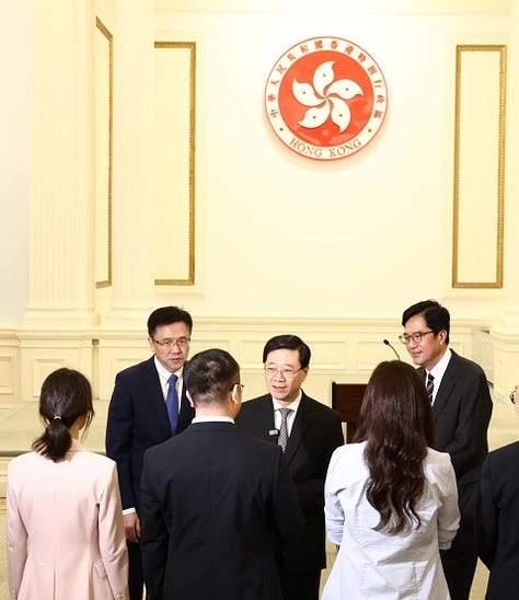 John Lee Ka-chiu and other Hong Kong officials meet the city's taikonaut candidates in June 2023.