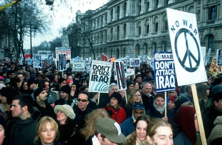 Protesters march along Whitehall in London, 15 February 2003.