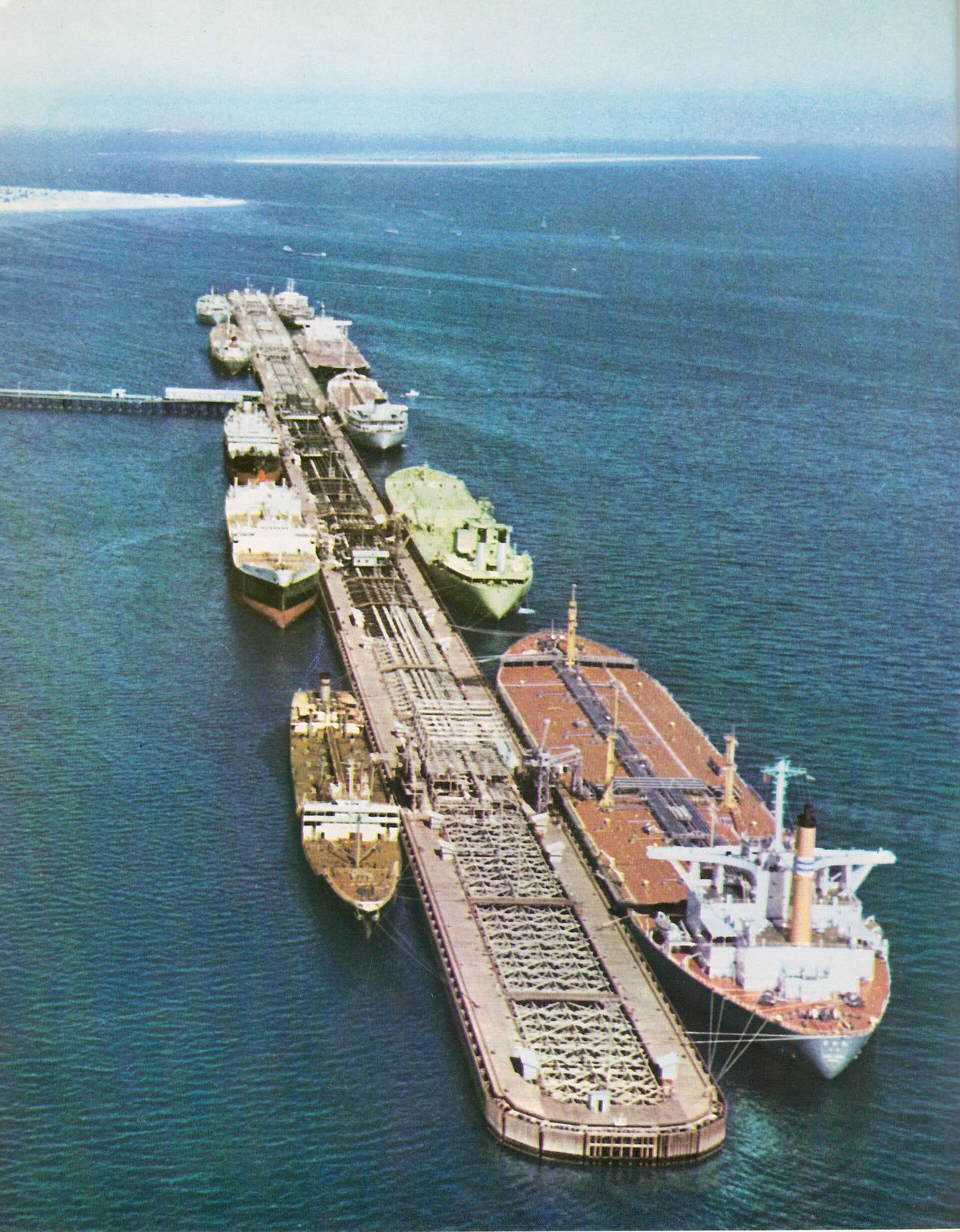 Aerial view of Kharg Island oil loading terminal in the Persian Gulf, where tankers dock to load Iranian crude oil for export. Photo: Public Domain