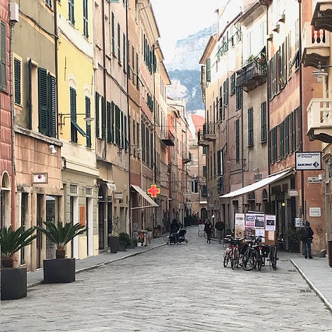 Pictures of cheese, lemons, Buddha's Hand citrus, bottles of chinotto and views of the town.