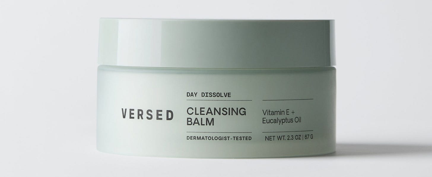 Versed Day Dissolve cleansing balm in a pale green jar with white lid, labeled with Vitamin E and Eucalyptus Oil ingredients.